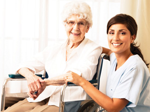 caregiver with elderly senior women home from the hospital